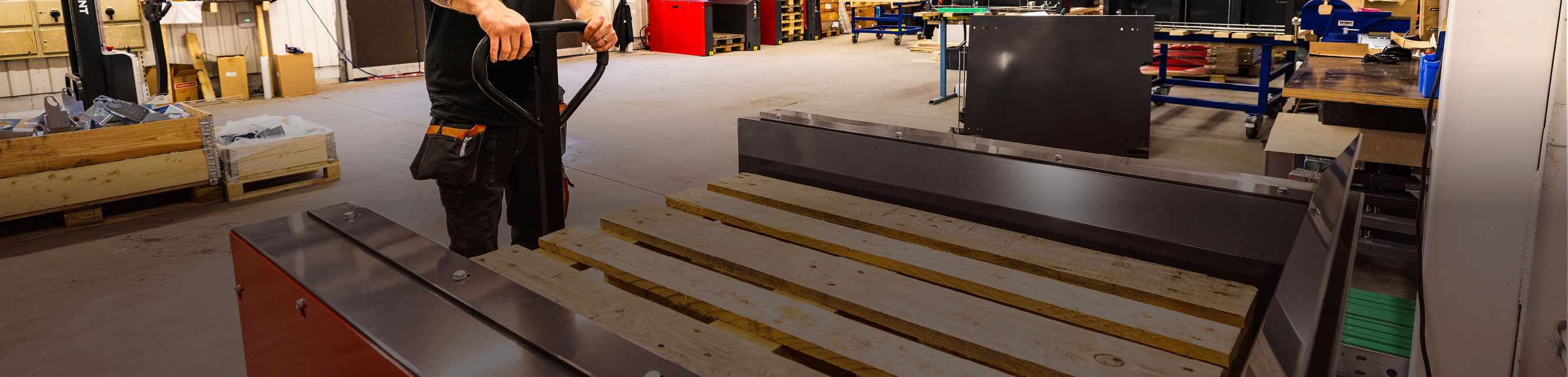 PalletMaster® electric pallet dispensers in an industrial warehouse environment